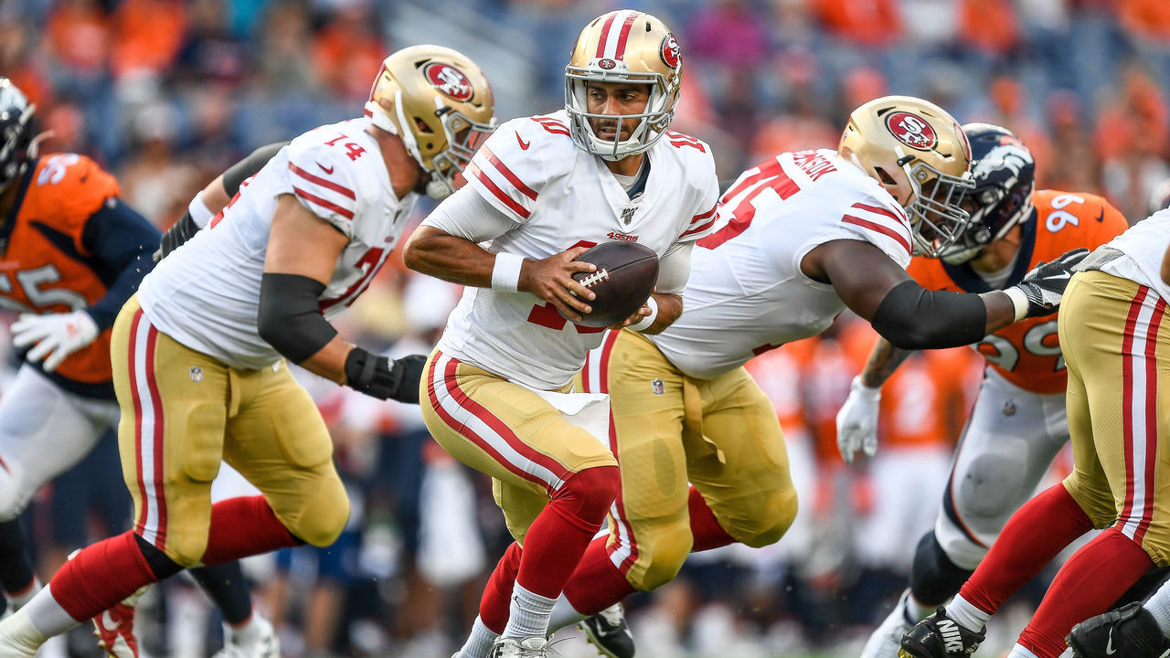 DENVER, CO - AUGUST 19: Quarterback Jimmy Garoppolo #10 of the San Francisco 49ers turns to hand the ball off against the Denver Broncos in the first quarter during a preseason National Football League game at Broncos Stadium at Mile High on August 19, 2019 in Denver, Colorado.