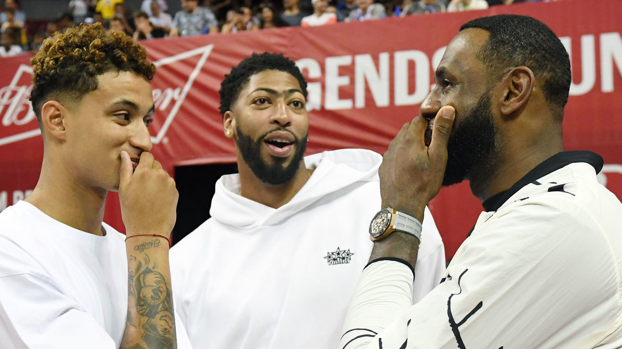 LAS VEGAS, NEVADA - JULY 06: (L-R) Kyle Kuzma, Anthony Davis and LeBron James of the Los Angeles Lakers talk before a game between the Lakers and the LA Clippers during the 2019 NBA Summer League at the Thomas & Mack Center on July 6, 2019 in Las Vegas, Nevada.