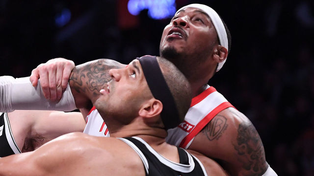 NEW YORK, NY - NOVEMBER 02: Carmelo Anthony #7 of the Houston Rockets fights for the ball against Jared Dudley #6 and Joe Harris #12 of the Brooklyn Nets during the game at Barclays Center on November 02, 2018 in the Brooklyn borough of New York City.