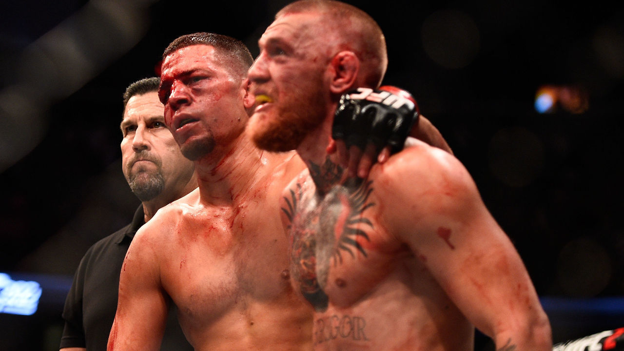 LAS VEGAS, NV - AUGUST 20: (L-R) Nate Diaz and Conor McGregor of Ireland embrace after finishing five rounds in their welterweight bout during the UFC 202 event at T-Mobile Arena on August 20, 2016 in Las Vegas, Nevada.