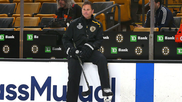 BOSTON - JUNE 11: Boston Bruins coach Bruce Cassidy sits on the boards in front of the bench during a practice in preparation for Game 7 of the 2019 Stanley Cup Finals against the St. Louis Blues at TD Garden in Boston on June 11, 2019.