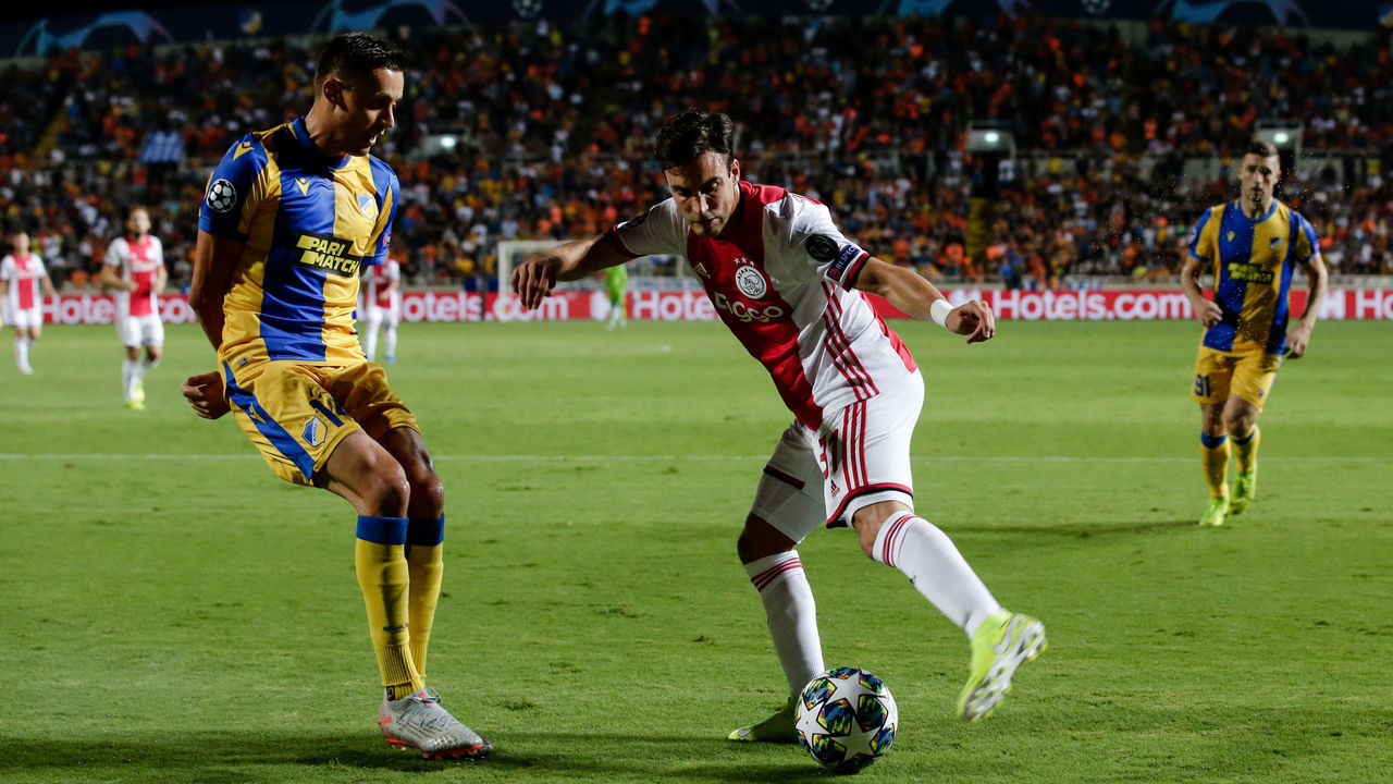 NICOSIA, CYPRUS - AUGUST 20: (L-R) Uros Matic of APOEL FC, Nicolas Tagliafico of Ajax during the UEFA Champions League match between Apoel Nicosia v Ajax at the GSP Stadium on August 20, 2019 in Nicosia Cyprus