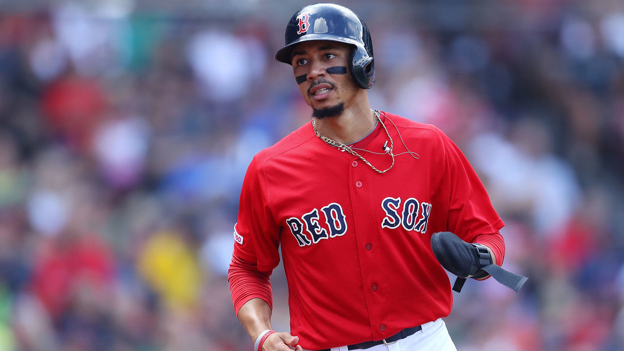 BOSTON, MASSACHUSETTS - AUGUST 18: Mookie Betts #50 of the Boston Red Sox runs to the dugout after scoring a run against the Baltimore Orioles during the third inning at Fenway Park on August 18, 2019 in Boston, Massachusetts.