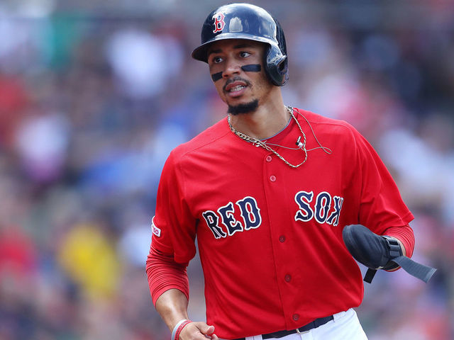 BOSTON, MASSACHUSETTS - AUGUST 18: Mookie Betts #50 of the Boston Red Sox runs to the dugout after scoring a run against the Baltimore Orioles during the third inning at Fenway Park on August 18, 2019 in Boston, Massachusetts.