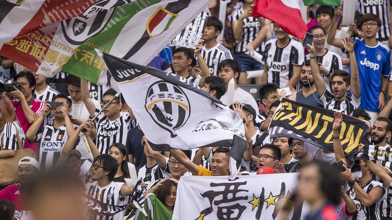 HONG KONG - JULY 30: Juventus' fans from China celebrate during the South China vs Juventus match of the AET International Challenge Cup on 30 July 2016 at Hong Kong Stadium, in Hong Kong, Hong Kong.