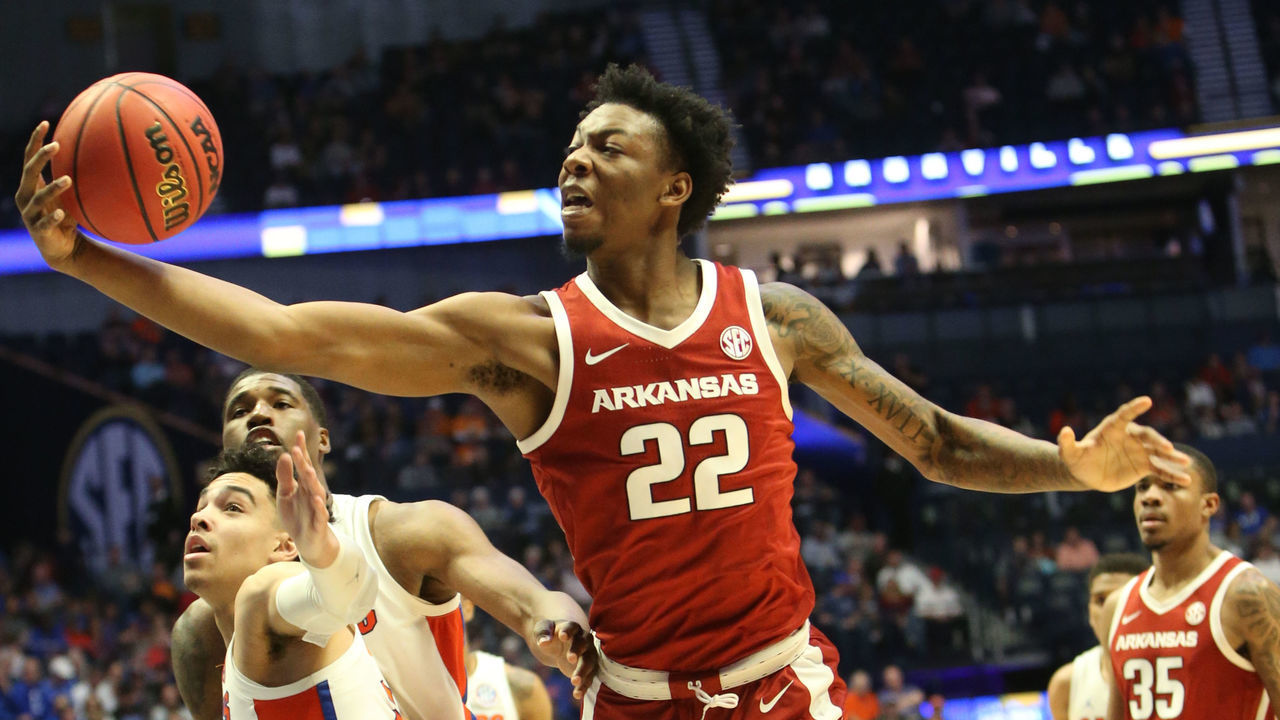 NASHVILLE, TN - MARCH 14: Arkansas Razorbacks forward Gabe Osabuohien (22) grabs a rebound during a Southeastern Conference Tournament game between the Arkansas Razorbacks and Florida Gators, March 14, 2019, at Bridgestone Arena in Nashville, Tennessee.