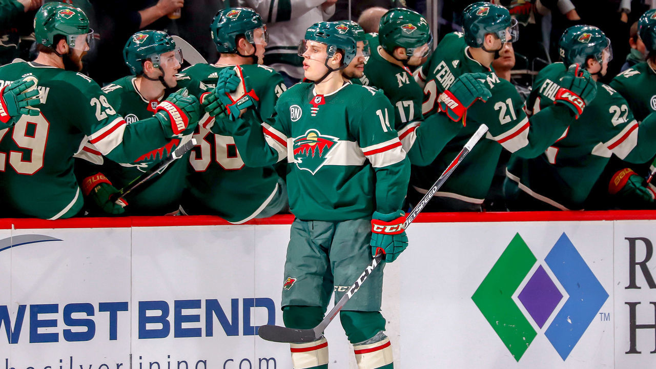 ST. PAUL, MN - APRIL 2: Joel Eriksson Ek #14 of the Minnesota Wild celebrates his second period goal against the Winnipeg Jets with teammates at the bench at the Xcel Energy Center on April 2, 2019 in St. Paul, Minnesota.