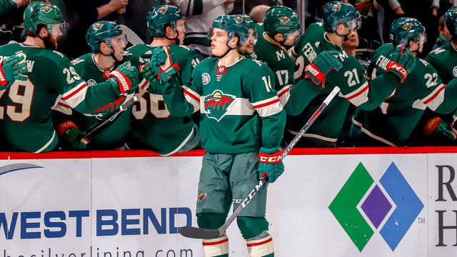 ST. PAUL, MN - APRIL 2: Joel Eriksson Ek #14 of the Minnesota Wild celebrates his second period goal against the Winnipeg Jets with teammates at the bench at the Xcel Energy Center on April 2, 2019 in St. Paul, Minnesota.