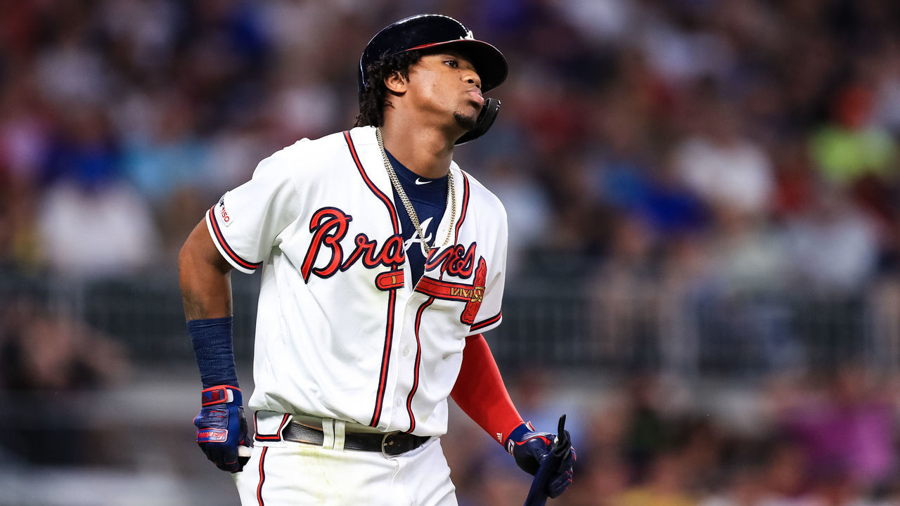 ATLANTA, GA - AUGUST 15: Ronald Acuna Jr. #13 of the Atlanta Braves walks to first base during the game against the New York Mets at SunTrust Park on August 15, 2019 in Atlanta, Georgia.
