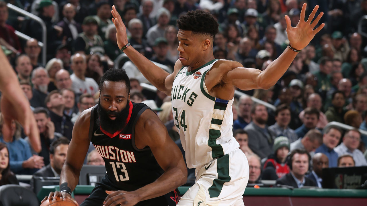 MILWAUKEE, WI - MARCH 26: James Harden #13 of the Houston Rockets handles the ball against Giannis Antetokounmpo #34 of the Milwaukee Bucks on March 26, 2019 at the Fiserv Forum in Milwaukee, Wisconsin. Mandatory Copyright Notice: Copyright 2019 NBAE