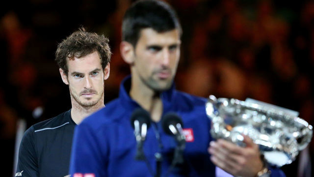 MELBOURNE, AUSTRALIA - JANUARY 31: Australian Open champion Novak Djokovic of Serbia holds the Norman Brookes Challenge Cup as Andy Murray of Great Britain looks on after the Men's Singles Final during day 14 of the 2016 Australian Open at Melbourne Park on January 31, 2016 in Melbourne, Australia.