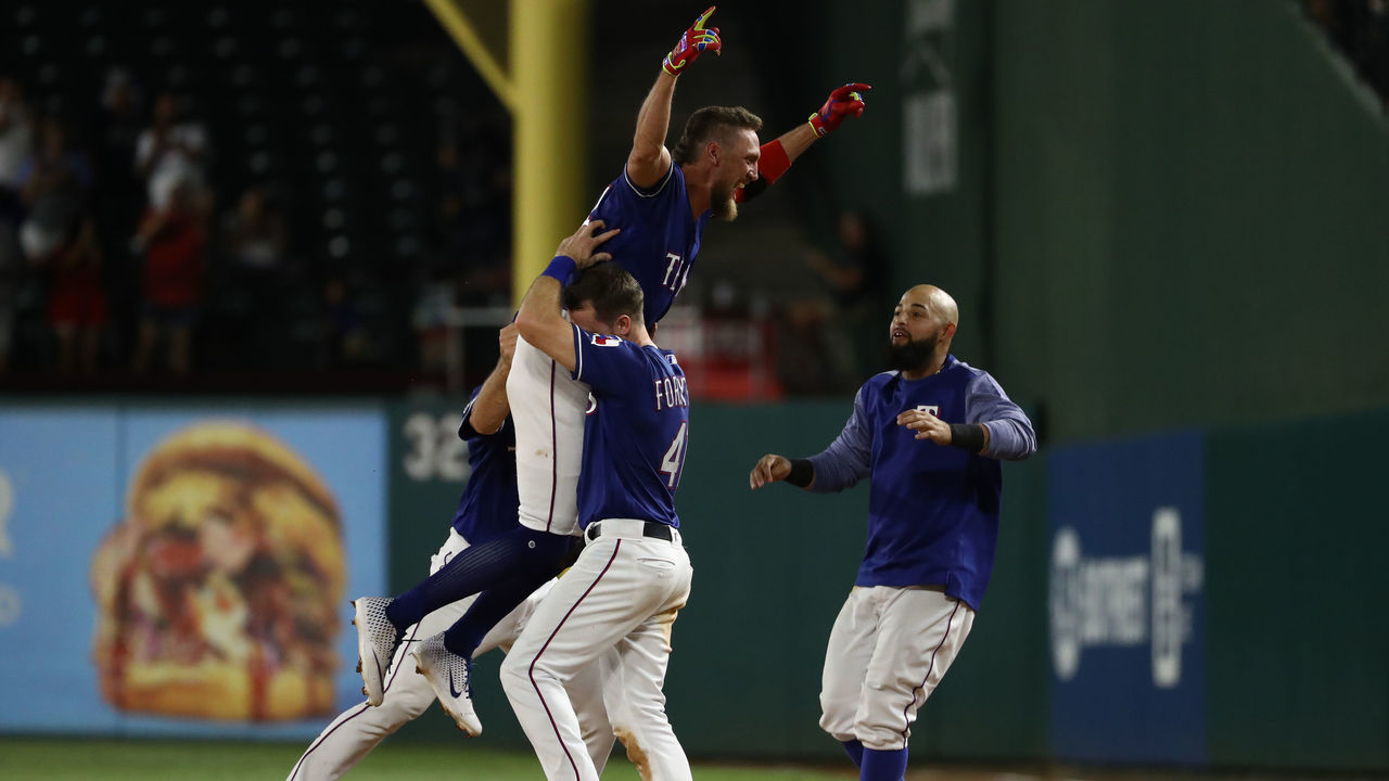 ARLINGTON, TEXAS - AUGUST 21: Hunter Pence #24 of the Texas Rangers celebrates a walk off hit against the Los Angeles Angels at Globe Life Park in Arlington on August 21, 2019 in Arlington, Texas.