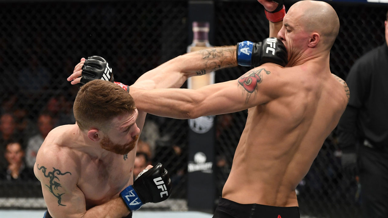 PHOENIX, ARIZONA - FEBRUARY 17: (L-R) Paul Felder punches James Vick in their lightweight bout during the UFC Fight Night event at Talking Stick Andre Fili, Myles Jury Arena on February 17, 2019 in Phoenix, Arizona.