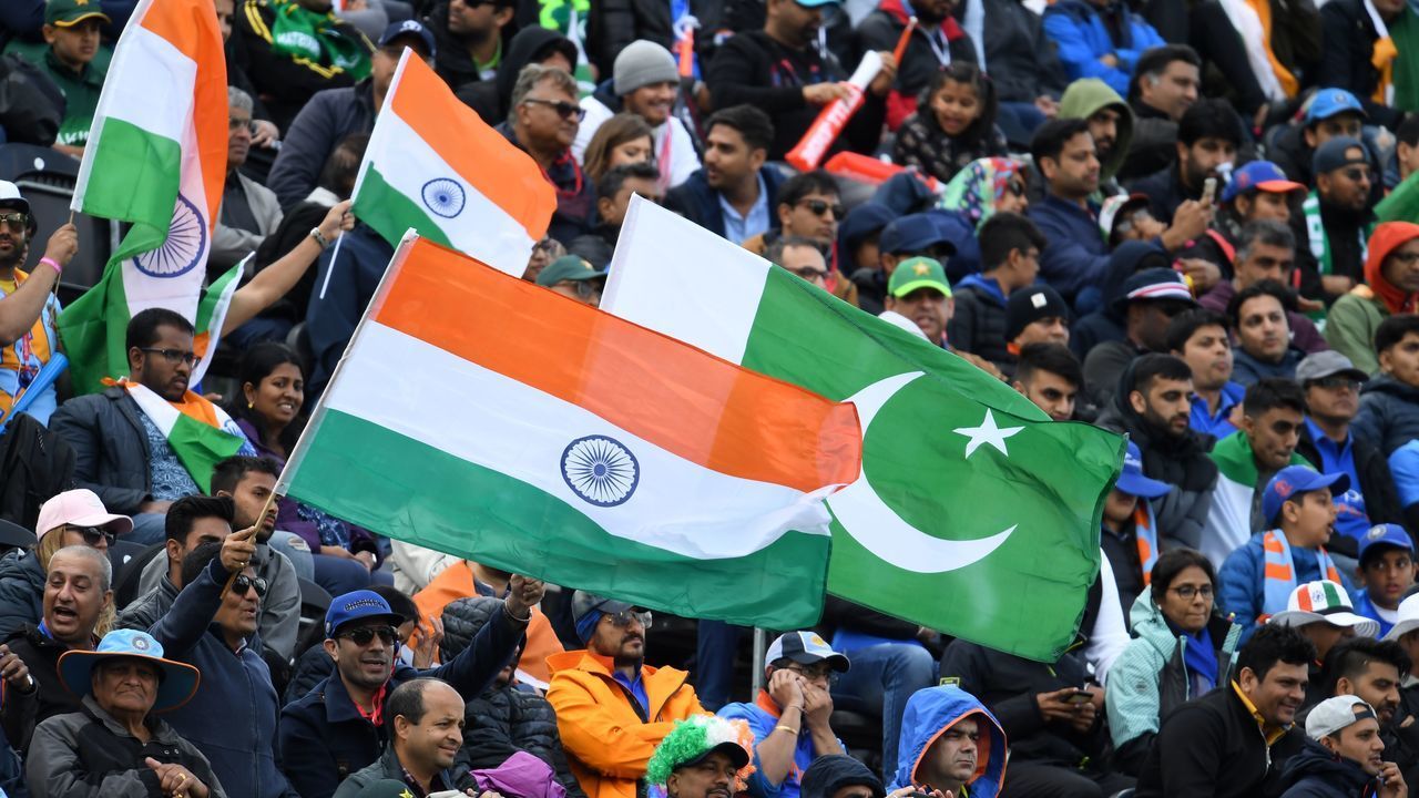 Spectators wave flags during the 2019 Cricket World Cup group stage match between India and Pakistan at Old Trafford in Manchester, northwest England, on June 16, 2019.