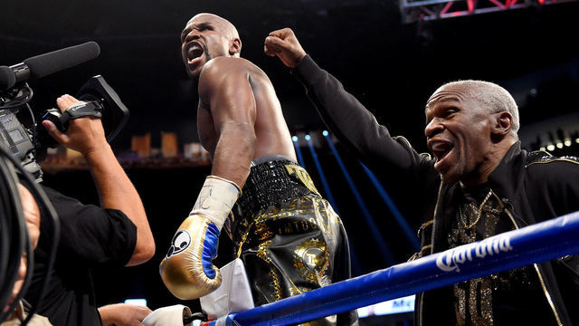LAS VEGAS, NV - AUGUST 26: (L-R) Floyd Mayweather Jr. and Floyd Mayweather Sr. celebrate after defeating Conor McGregor during their super welterweight boxing match on August 26, 2017 at T-Mobile Arena in Las Vegas, Nevada.