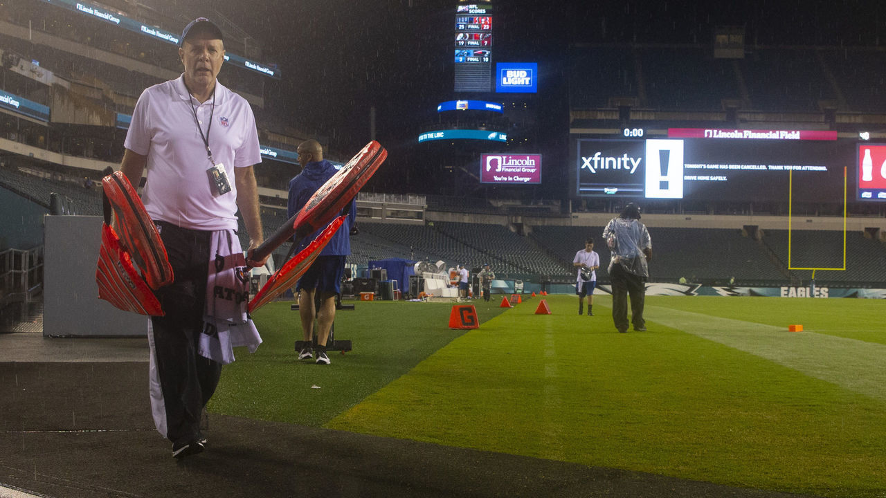PHILADELPHIA, PA - AUGUST 22: An NFL league official walks off the field after the preseason game between the Baltimore Ravens and Philadelphia Eagles was cancelled in the fourth quarter due to weather at Lincoln Financial Field on August 22, 2019 in Philadelphia, Pennsylvania.