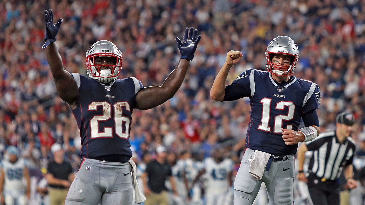 FOXBORO, MA. - AUGUST 22: Sony Michel #26 and Tom Brady #12 of the New England Patriots celebrate a touchdown during the second quarter of the NFL pre-season game against the Carolina Panthers at Gillette Stadium on August 22, 2019 in Foxboro, Massachusetts. (Staff Photo By Matt Stone/MediaNews Group/Boston Herald)