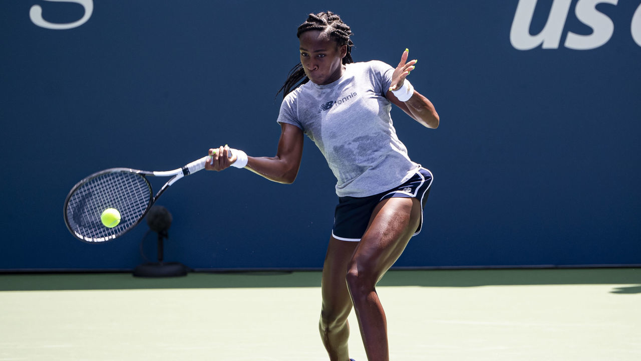 NEW YORK, NEW YORK - AUGUST 22: Cori Gauff of the United States practices with her coaches Jean-Christophe Faure and her father, Corey Gauff, before the start of the US Open at the USTA Billie Jean King National Tennis Center on August 22, 2019 in New York City.
