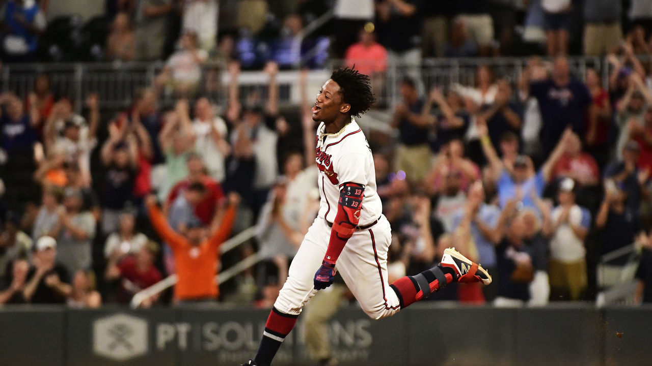ATLANTA, GEORGIA - AUGUST 22: Ronald Acuna Jr. #13 of the Atlanta Braves hits a walk off single in the ninth inning against the Miami Marlins at SunTrust Park on August 22, 2019 in Atlanta, Georgia.