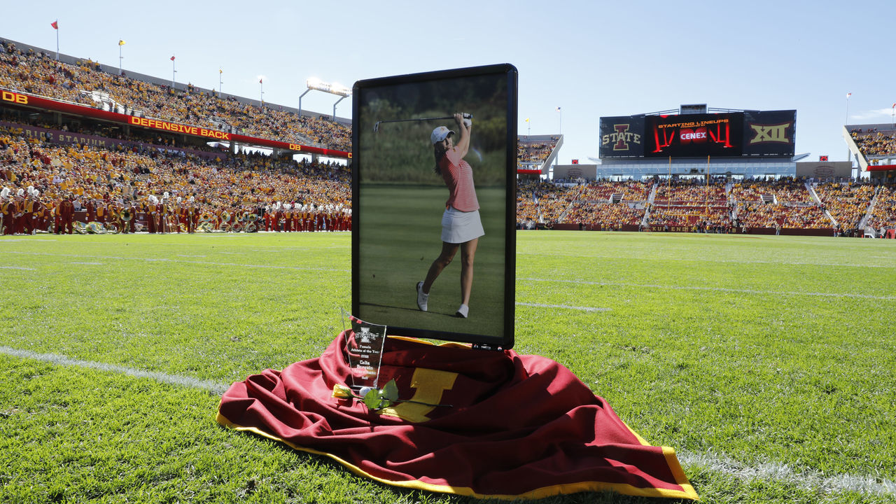 AMES, IA - SEPTEMBER 22: A small memorial was set up before a pre-game moment of silence to honor Celia Barquin Aromzamena at Jack Trice Stadium on September 22, 2018 in Ames, Iowa. Celia Barquin Aromzamena Iowa States 2018 Big 12 Women's Golf Champion, was murdered Monday September 17th while playing golf on a course near the college.