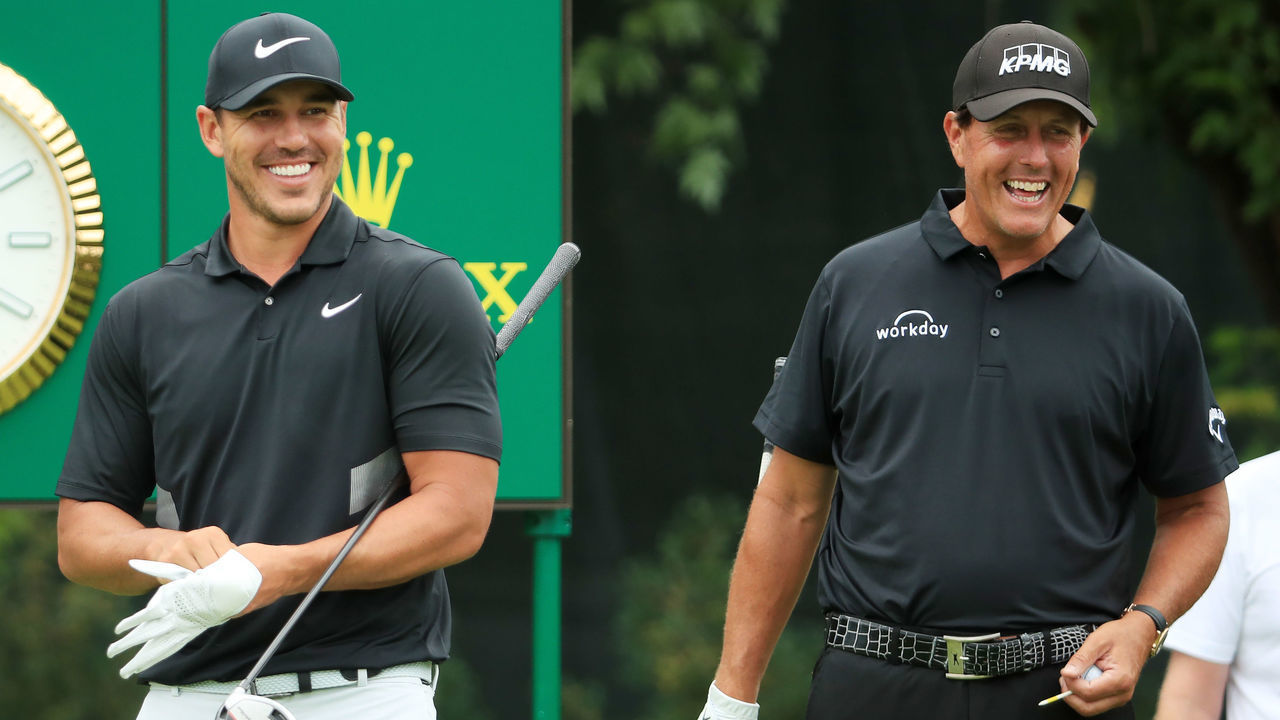 MEDINAH, ILLINOIS - AUGUST 18: Brooks Koepka of the United States and Phil Mickelson of the United States talk on the tenth tee during the final round of the BMW Championship at Medinah Country Club No. 3 on August 18, 2019 in Medinah, Illinois.