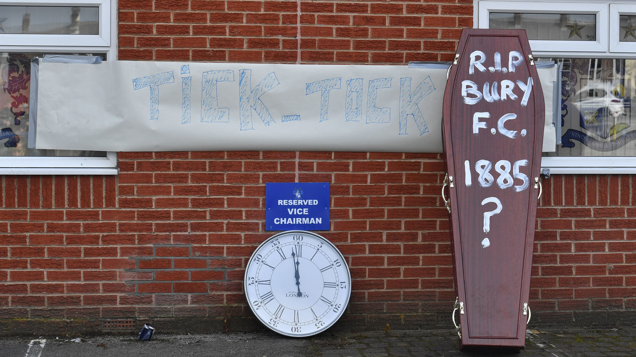 Bury fans deliver a symbolic coffin reading 'R.I.P Bury F.C. 1885 ?' and clock at Gigg Lane, home of Bury FC.