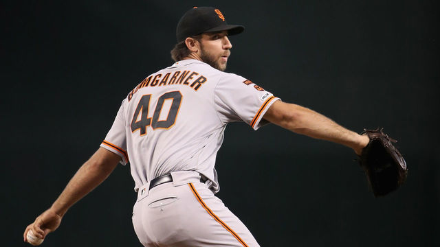 PHOENIX, ARIZONA - AUGUST 18: Starting pitcher Madison Bumgarner #40 of the San Francisco Giants throws a warm-up pitch during the first inning of the MLB game against the Arizona Diamondbacks at Chase Field on August 18, 2019 in Phoenix, Arizona.