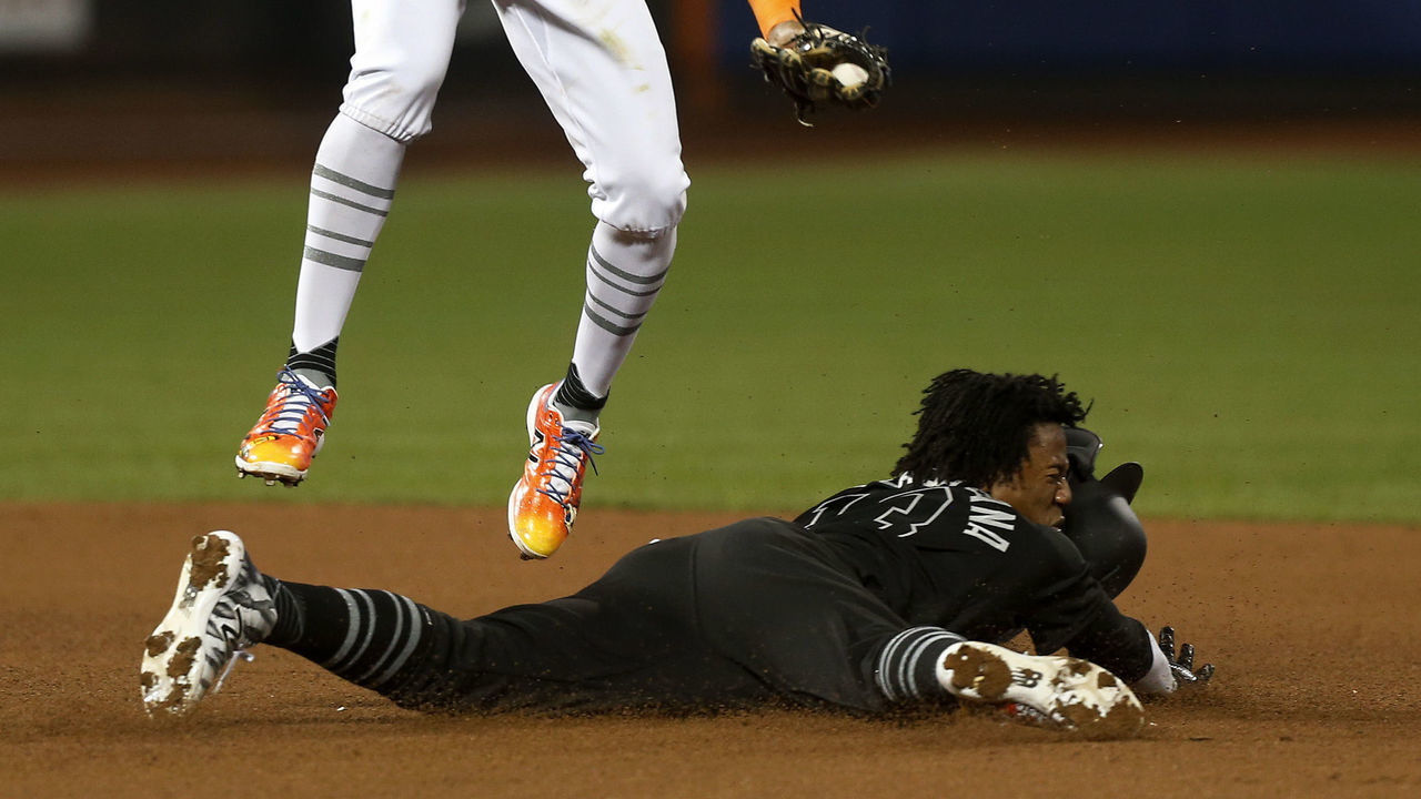 NEW YORK, NEW YORK - AUGUST 23: Ronald Acuna Jr. #13 of the Atlanta Braves steals second base during the eighth inning as Amed Rosario #1 of the New York Mets can't make the tag at Citi Field on August 23, 2019 in New York City. Teams are wearing special color schemed uniforms with players choosing nicknames to display for Players Weekend.