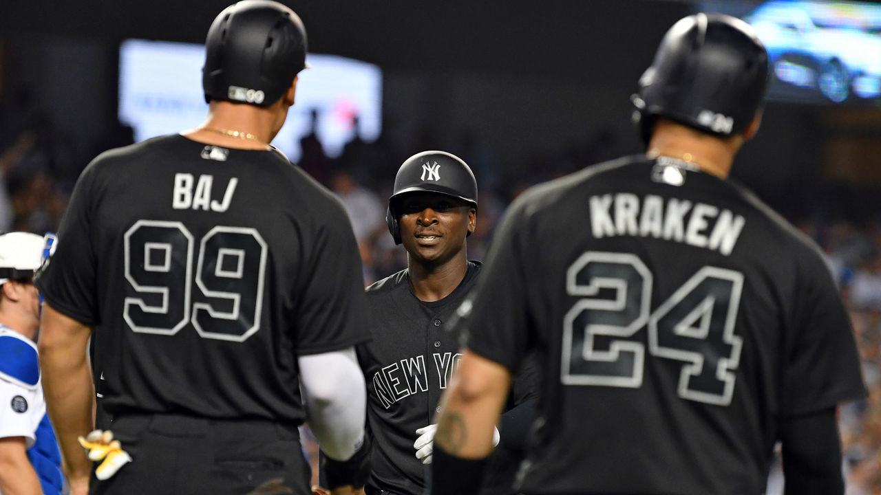 LOS ANGELES, CA - AUGUST 23: New York Yankees shortstop Didi Gregorius (18) is greeted by his teammates after Didi hit a grand slam home run in the fifth inning of a game against the Los Angeles Dodgers played on August 23, 2019 at Dodger Stadium in Los Angeles, CA. Gregorius is wearing a players weekend uniform.