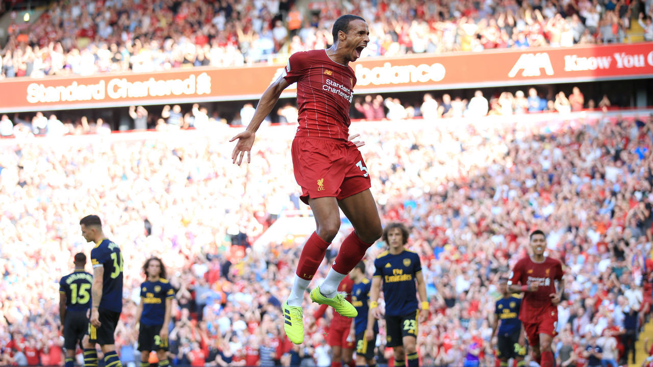LIVERPOOL, ENGLAND - AUGUST 24: Joel Matip of Liverpool celebrates after scoring their 1st goal during the Premier League match between Liverpool and Arsenal at Anfield on August 24, 2019 in Liverpool, United Kingdom.