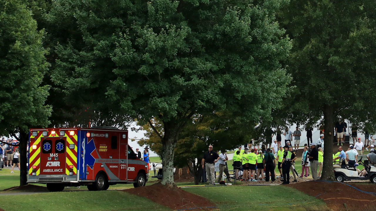 ATLANTA, GEORGIA - AUGUST 24: An ambulance arrives to provide medical assistance after a lightning strike during a suspension of the third round due to inclement weather of the TOUR Championship at East Lake Golf Club on August 24, 2019 in Atlanta, Georgia.