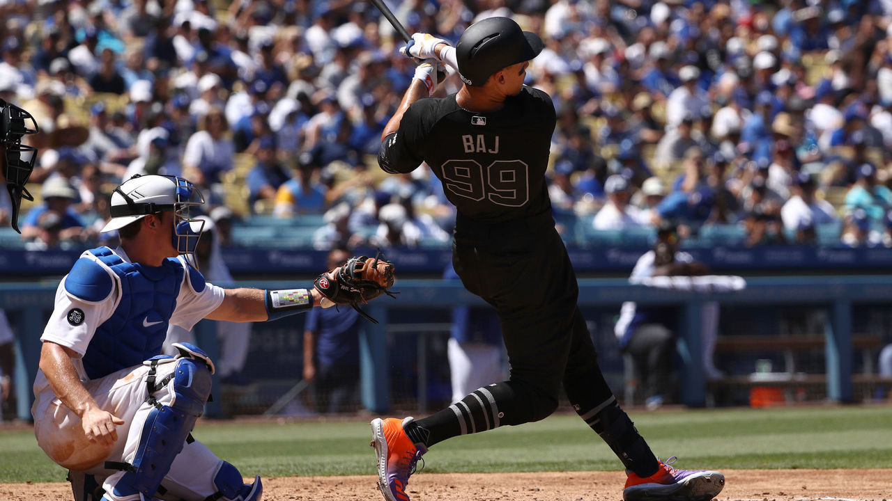 LOS ANGELES, CALIFORNIA - AUGUST 24: Aaron Judge #99 of the New York Yankees hits a solo home run during the fourth inning of the MLB game against the Los Angeles Dodgers at Dodger Stadium on August 24, 2019 in Los Angeles, California. Teams are wearing special color-schemed uniforms with players choosing nicknames to display for Players' Weekend.
