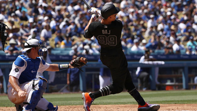 LOS ANGELES, CALIFORNIA - AUGUST 24: Aaron Judge #99 of the New York Yankees hits a solo home run during the fourth inning of the MLB game against the Los Angeles Dodgers at Dodger Stadium on August 24, 2019 in Los Angeles, California. Teams are wearing special color-schemed uniforms with players choosing nicknames to display for Players' Weekend.