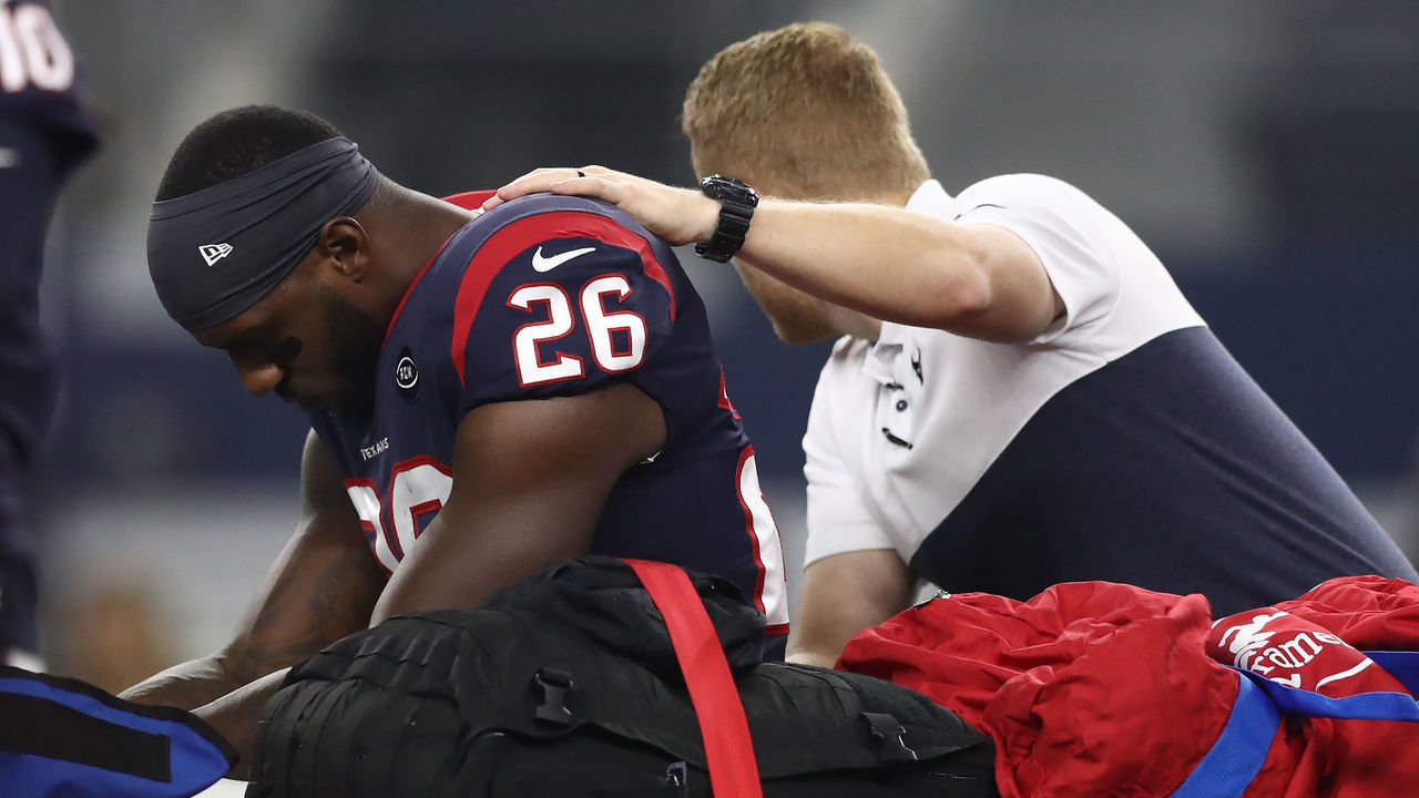 ARLINGTON, TEXAS - AUGUST 24: Lamar Miller #26 of the Houston Texans leaves the game after an injury in the first quarter during a NFL preseason game against the Dallas Cowboys at AT&T Stadium on August 24, 2019 in Arlington, Texas.