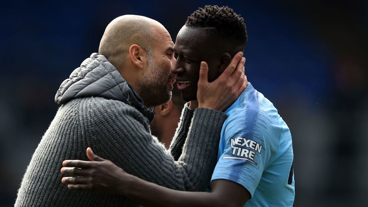 LONDON, ENGLAND - APRIL 14: Pep Guardiola manager of Manchester City with Benjamin Mendy during the Premier League match between Crystal Palace and Manchester City at Selhurst Park on April 14, 2019 in London, United Kingdom.