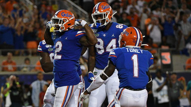 ORLANDO, FL - AUGUST 24: Lamical Perine #2 of the Florida Gators celebrates scoring a touchdown with teammates in the second half against the Miami Hurricanes in the Camping World Kickoff at Camping World Stadium on August 24, 2019 in Orlando, Florida.