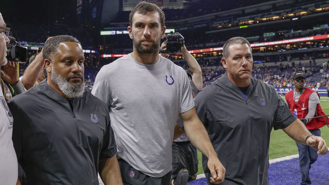 INDIANAPOLIS, IN - AUGUST 24: Andrew Luck #12 of the Indianapolis Colts walks off the field following reports of his retirement from the NFL after the preseason game against the Chicago Bears at Lucas Oil Stadium on August 24, 2019 in Indianapolis, Indiana.