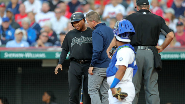 CLEVELAND, OH - AUGUST 24: Cleveland Indians third baseman Jose Ramirez (11) is examined by a trainer during the first inning of the Major League Baseball game between the Kansas City Royals and Cleveland Indians on August 24, 2019, at Progressive Field in Cleveland, OH. Ramirez left the game with right wrist discomfort.