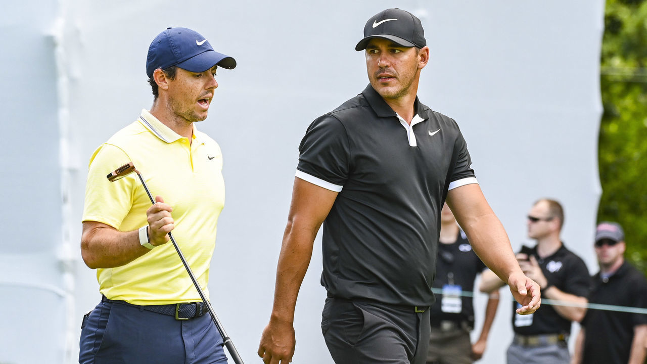MEDINAH, IL - AUGUST 15: Rory McIlroy of Northern Ireland and Brooks Koepka talk as they walk off the 17th hole tee box during the first round of the BMW Championship, the second event of the FedExCup Playoffs, at Medinah Country Club (No. 3) on August 15, 2019 in Medinah, Illinois.