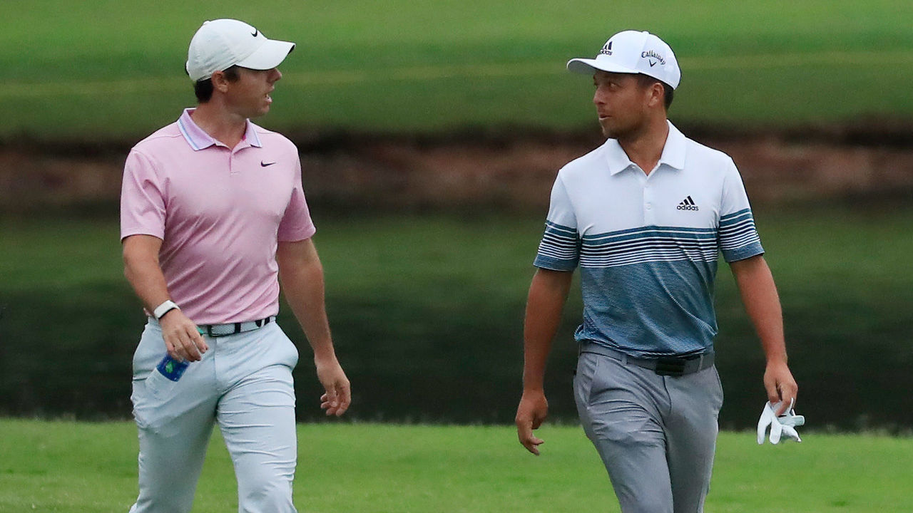 ATLANTA, GEORGIA - AUGUST 25: Rory McIlroy of Northern Ireland and Xander Schauffele of the United States walk on the eighth hole during the continuation of the weather delayed third round of the TOUR Championship at East Lake Golf Club on August 25, 2019 in Atlanta, Georgia.