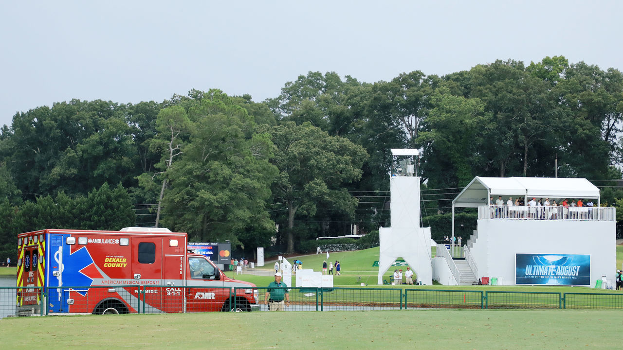 ATLANTA, GEORGIA - AUGUST 24: An ambulance arrives to provide medical assistance after a lightning strike during a suspension of the third round due to inclement weather of the TOUR Championship at East Lake Golf Club on August 24, 2019 in Atlanta, Georgia.