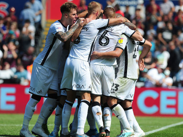 SWANSEA, WALES - AUGUST 25: Borja Baston of Swansea City celebrates scoring his side's third goal with team mates during the Sky Bet Championship match between Swansea City and Birmingham City at the Liberty Stadium on August 25, 2019 in Swansea, Wales.