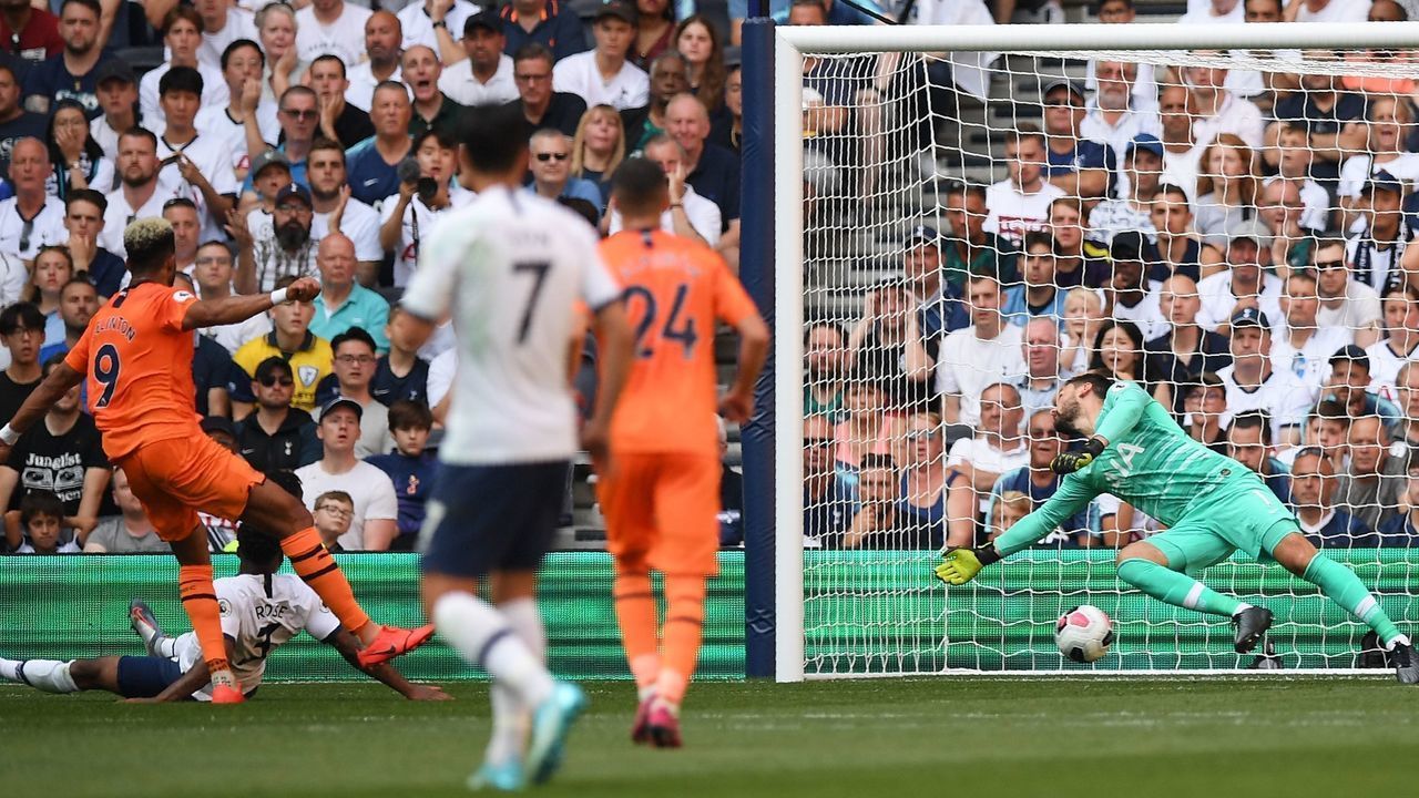 Newcastle United's Brazilian striker Joelinton (L) shoots past Tottenham Hotspur's French goalkeeper Hugo Lloris (R) to score the opening goal of the English Premier League football match between Tottenham Hotspur and Newcastle United at Tottenham Hotspur Stadium in London, on August 25, 2019.