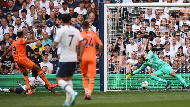 Newcastle United's Brazilian striker Joelinton (L) shoots past Tottenham Hotspur's French goalkeeper Hugo Lloris (R) to score the opening goal of the English Premier League football match between Tottenham Hotspur and Newcastle United at Tottenham Hotspur Stadium in London, on August 25, 2019.