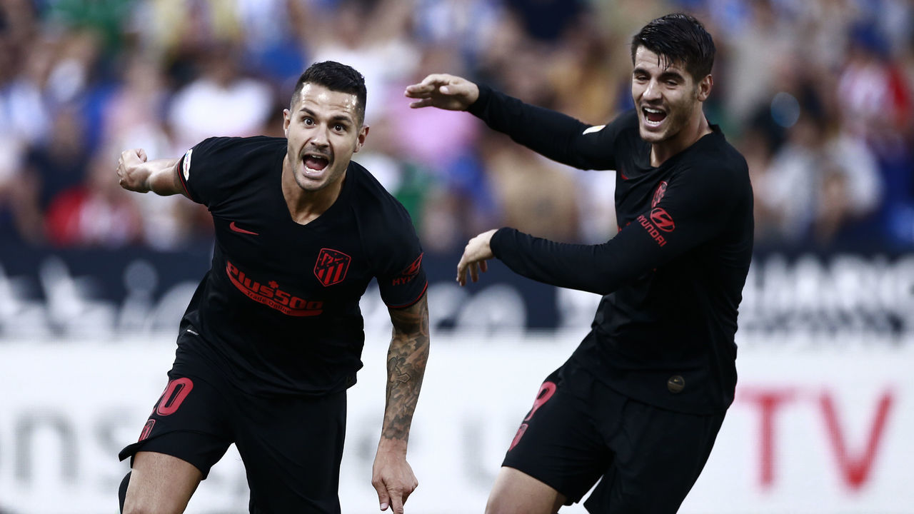 Atletico Madrid's Spanish midfielder Vitolo (L) celebrates with Atletico Madrid's Spanish forward Alvaro Morata after scoring a goal during the Spanish League football match between Leganes and Atletico Madrid at the Butarque stadium in Leganes, southwest of Madrid, on August 25, 2019.