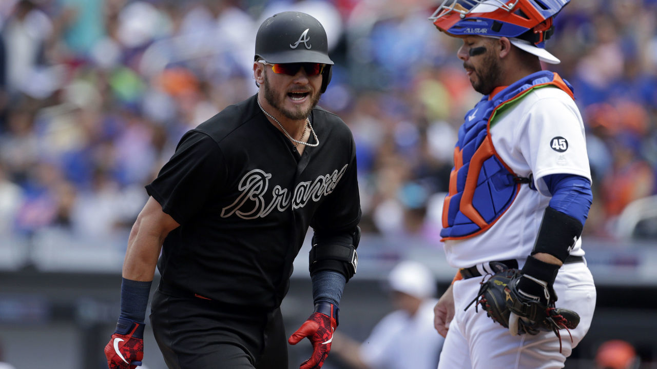 NEW YORK, NY - AUGUST 25: Josh Donaldson #20 of the Atlanta Braves celebrates after hitting a solo home run during the second inning in front of Rene Rivera #44 of the New York Mets at Citi Field on August 25, 2019 in the Flushing neighborhood of the Queens borough of New York City. Teams are wearing special color-schemed uniforms with players choosing nicknames to display for Players' Weekend. The Braves won 2-1.