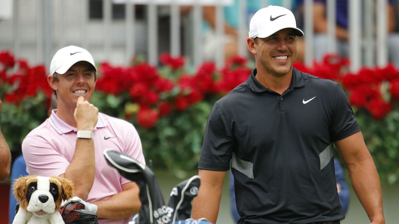 ATLANTA, GA - AUGUST 25: Brooks Koepka has a laugh with Rory McIlroy of Northern Ireland prior to their start of the final round of the TOUR Championship at East Lake Golf Club in Atlanta, GA.