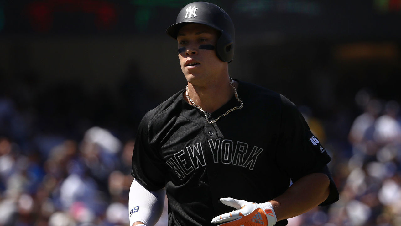 LOS ANGELES, CALIFORNIA - AUGUST 24: Aaron Judge #99 of the New York Yankees jogs toward the dugout after hitting a solo home run during the fourth inning of the MLB game against the Los Angeles Dodgers at Dodger Stadium on August 24, 2019 in Los Angeles, California. Teams are wearing special color-schemed uniforms with players choosing nicknames to display for Players' Weekend. The Dodgers defeated the Yankees 2-1.