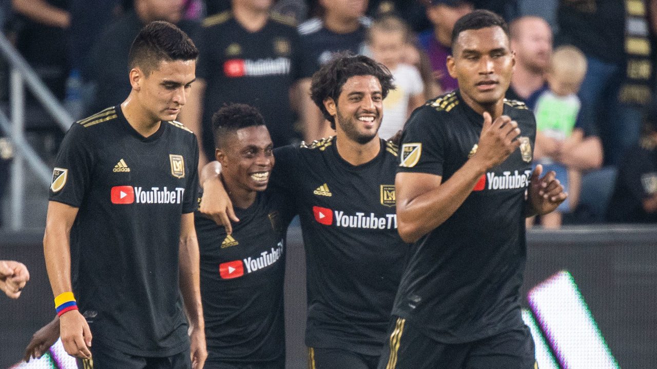 LOS ANGELES, CA - AUGUST 11: Latif Blessing #7 of Los Angeles FC celebrates his goal with Carlos Vela #10 of Los Angeles FC during Los Angeles FC's MLS match against New York Red Bulls at the Banc of California Stadium on August 11, 2019 in Los Angeles, California. Los Angeles FC won the match 4-2