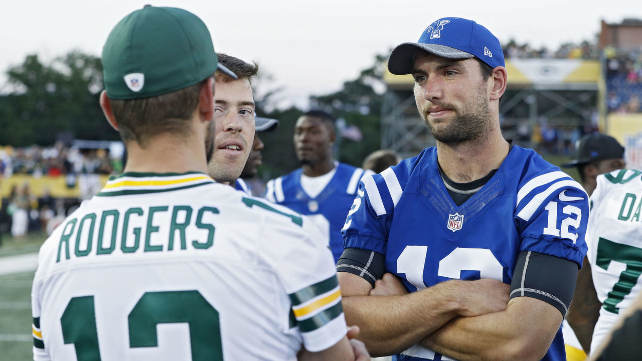 CANTON, OH - AUGUST 07: Andrew Luck #12 of the Indianapolis Colts talks with Aaron Rodgers #12 of the Green Bay Packers after the NFL Hall of Fame Game was canceled due to poor field conditions at Tom Benson Hall of Fame Stadium on August 7, 2016 in Canton, Ohio.
